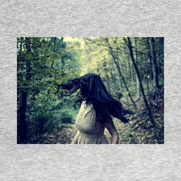 Scared girl running in the forest by naturalis